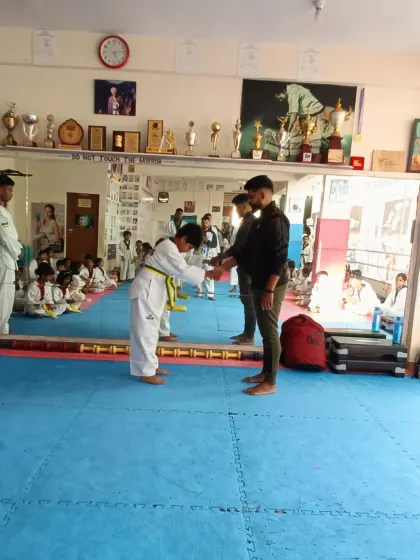 A bow of respect after receiving a new belt.