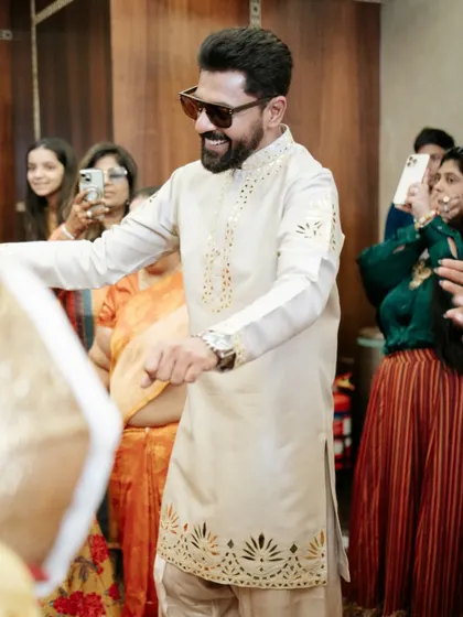 The groom's entrance, dancing his way into the Haldi celebration. We ensure the energy is high from the very first moment.