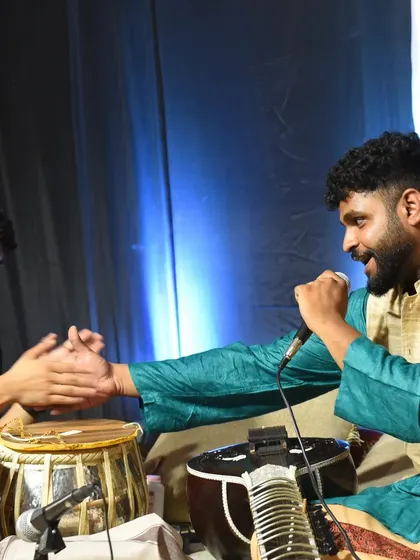 A moment of mutual appreciation with my tabla player after a particularly good musical exchange. This is the spontaneous joy of live performance.