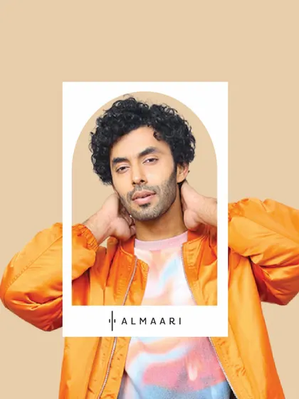 A pop of color for a casual, cool look. This model wears a bright orange bomber jacket over a tie-dye tee, showing off a more relaxed and trendy side of my collection.