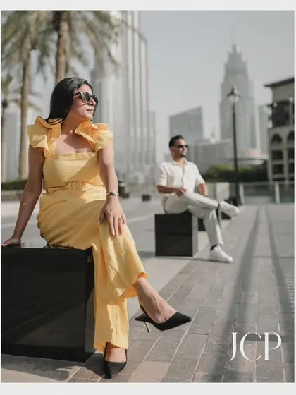 A fashionable shot in downtown Dubai, using the city's modern architecture to create a sophisticated pre-wedding portrait.