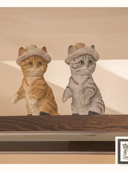 These charming cat figurines, complete with little hats, are perfect for adding a playful touch to a shelf or even a fish tank. They bring a bit of lighthearted fun to your decor.