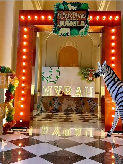 The full jungle entrance setup, showcasing the lit archway, personalized name display, and animal props. This design transforms a simple doorway into a gateway to adventure.