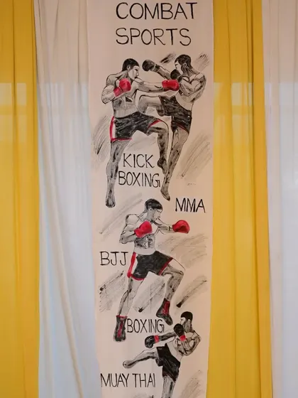 This banner showcases the variety of combat sports we teach, including Kickboxing, MMA, BJJ, Boxing, and Muay Thai. We provide comprehensive training across multiple disciplines to create well-rounded fighters.