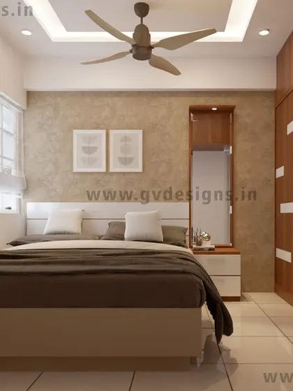 A wider view of the bedroom, showing the sliding wardrobe and its relationship to the rest of the space. The neutral color palette and textured wallpaper create a calm and inviting atmosphere, allowing the wardrobe's design to stand out.
