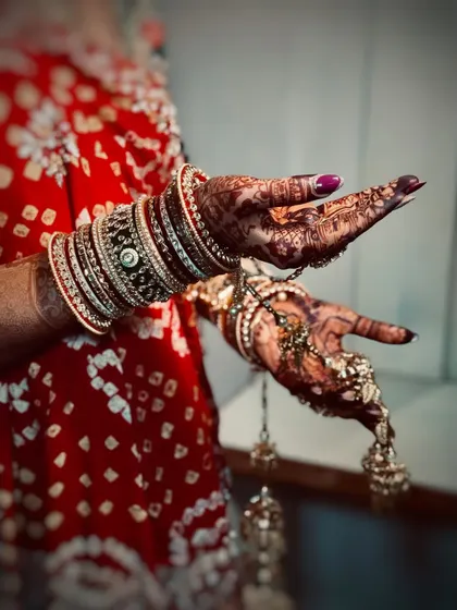 It's all in the details. A close-up of the bride's hands, showing her beautiful henna, bangles, and kalire, which are all part of the complete bridal look I help style.
