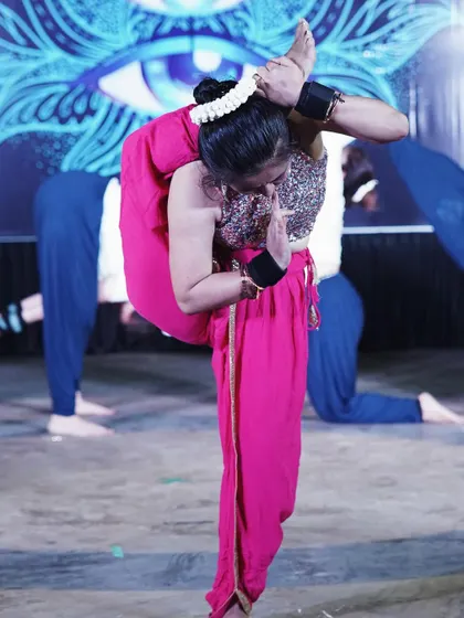 A yoga flow from our third annual event. This is a variation of Durvasasana, a challenging standing pose that requires extreme hip flexibility.