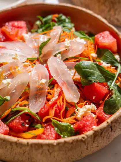 A close-up of a refreshing watermelon and feta salad at Blah Bombay. The shot emphasizes the fresh, high-quality ingredients used in the dish.