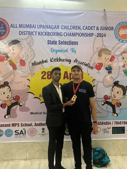 Celebrating a gold medal win at the All Mumbai Upanagar Kickboxing Championship. This is the result of consistent training and a powerful will to succeed.
