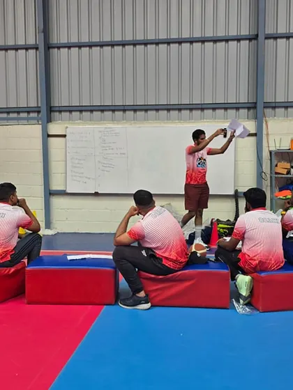 Our coaches engaged in learning and development during a clinic, ensuring they bring the latest and most effective training methods to our players.