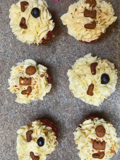 An overhead view of a batch of personalized peanut butter pupcakes. They're a fun and tasty way to celebrate.