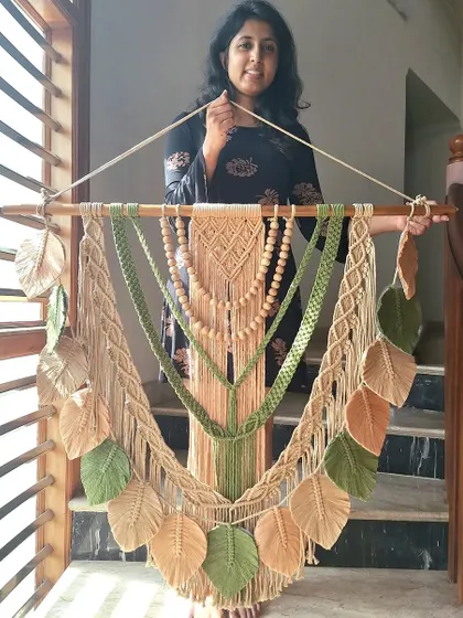 We crafted this custom macrame wall hanging with earthy green and beige tones to perfectly match our client's wall. It's a one-of-a-kind piece that blends textures and colors in beautiful harmony.