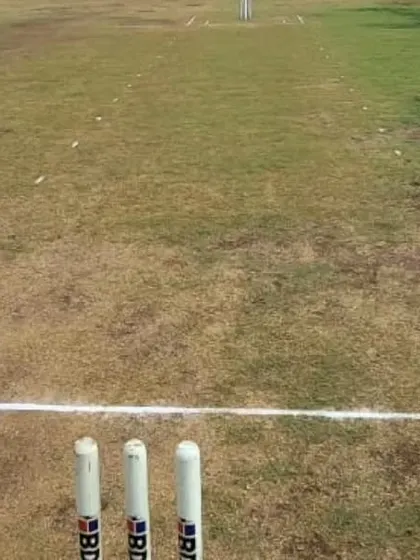 A first-person view from behind the stumps, looking down the pitch during our Hubli tour.