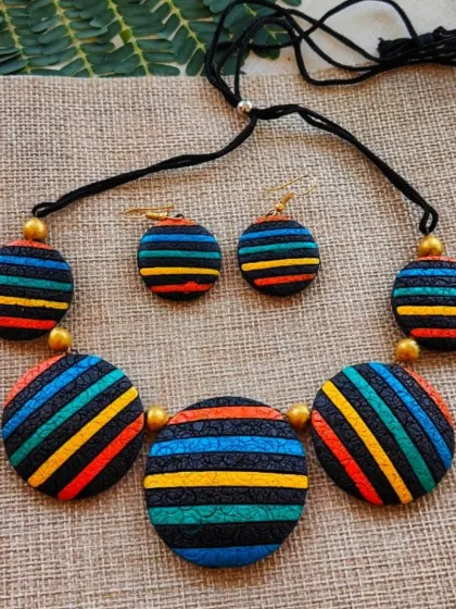 Another color variation of the striped circle necklace, with a cool palette of blue, green, and yellow.