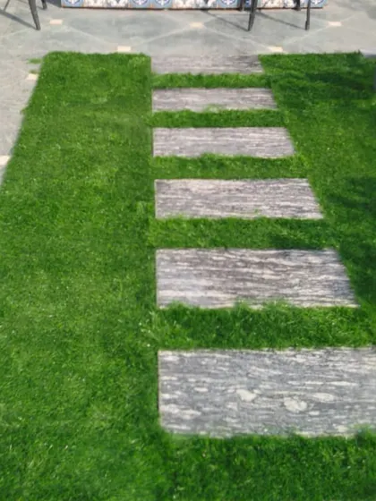 This detailed shot shows the texture of the taller pile grass used for this terrace floor. It looks just like real grass but requires none of the upkeep.