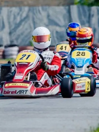 Mihir Avalakki in kart 21, leading the pack. His ability to control the race from the front is a key skill honed through our program.