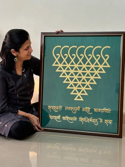 Admiring the final look of this grand Saraswati frame before it gets packed and shipped to the client.
