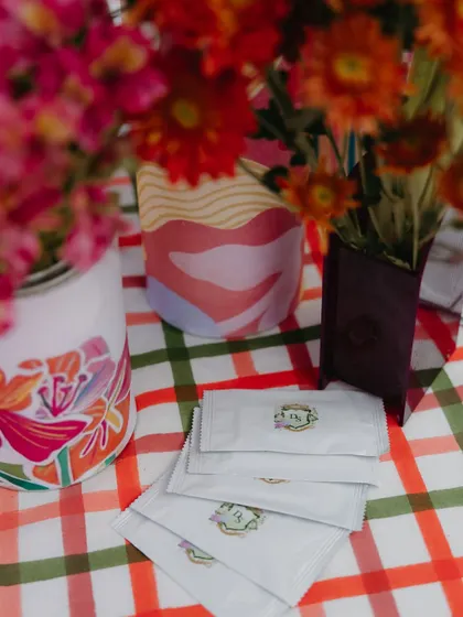 Custom-branded wet wipes for a carnival-themed Mehendi. No detail is too small when it comes to creating a cohesive, branded experience.