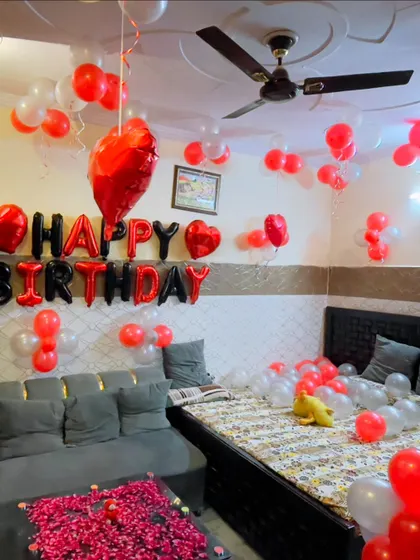A full room view of the red, black, and white birthday decoration, creating a vibrant party atmosphere at home.