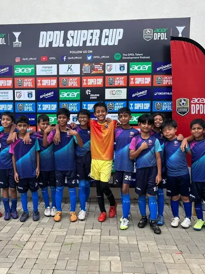 The full U11 squad posing for a photo after a great performance.
