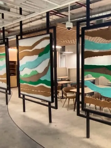 My art isn't just limited to paint. This is a series of large-scale tapestry installations I created for a corporate office in Hyderabad. It was my first time threading my way into art like this, and I loved working with new textures to divide and define the space.