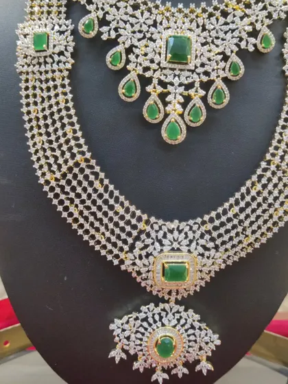 A close-up of the layered haram from the emerald and diamond-look set.