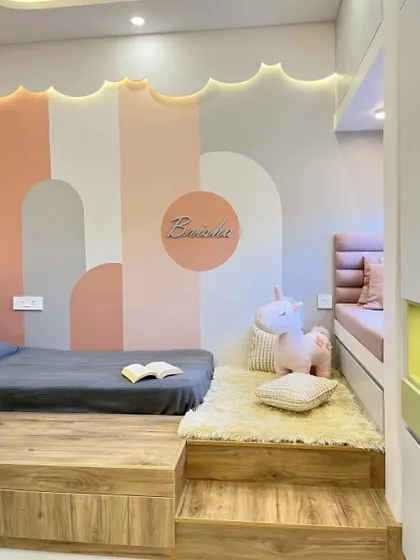 Another view of the platform bed and bay window seat, showing the soft rug and steps leading up to the bed. The design is playful, safe, and makes bedtime fun.