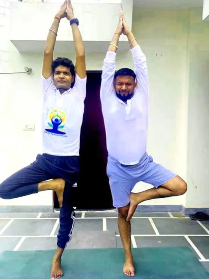 Practicing Vrikshasana (Tree Pose) together with a client. In my personal sessions, I often practice alongside you to provide clear visual guidance and motivation.