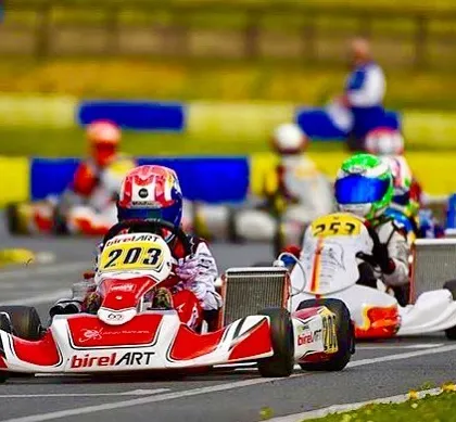 Our Birel ART driver leading a pack of karts during a WSK Euro Championship race. This showcases our team's ability to compete and succeed on the international stage.