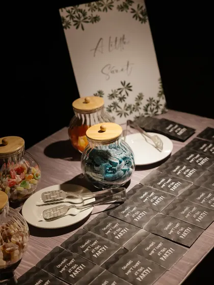 A "Little Sweet" candy bar where guests could pack their own bag of treats. It's a simple, interactive detail that adds a layer of fun to any event.