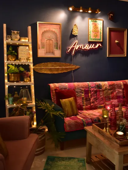 A festive look for my living room with a pop of neon. The 'Amour' sign adds a quirky, modern touch to the otherwise traditional and eclectic decor.