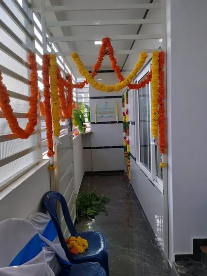 Simple marigold garlands used to decorate a corridor for a home function.