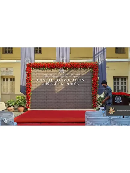 We were honored to decorate the annual convocation for the National Law University, Delhi. This stage backdrop, framed with a bold red floral border, provided a dignified and professional setting for such a prestigious academic event.