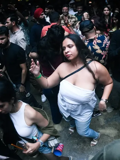 A woman on the dancefloor feeling free and expressing herself. This is what it's all about.