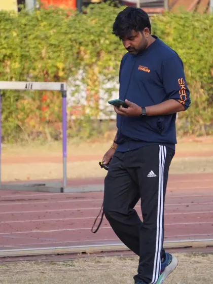 Reviewing performance data on my phone during a practice session.