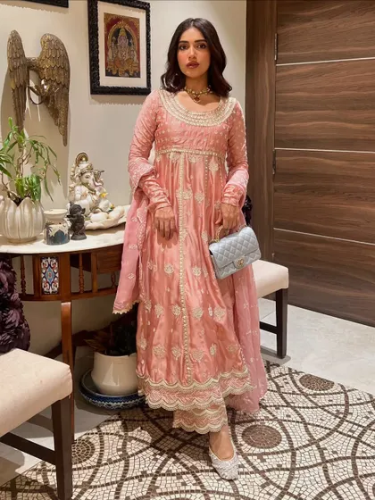 A full-length shot of Bhumi in her pink Anarkali, showing the complete head-to-toe styling with matching juttis.