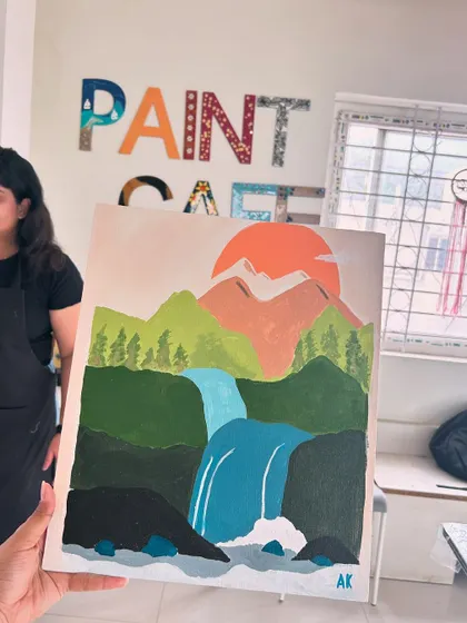 A serene waterfall landscape painted on canvas by one of our students.
