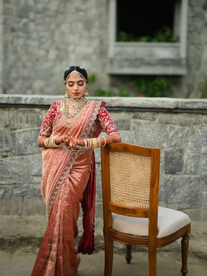 Our client exudes grace and poise in this stunning embellished saree. The intricate details and rich fabric make it a truly special piece for a wedding day.