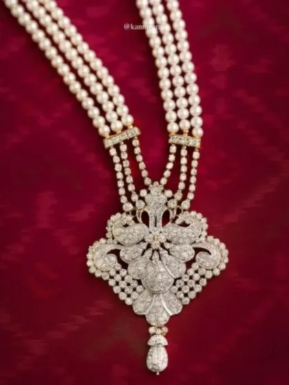 A closer look at the craftsmanship of this diamond and pearl bridal necklace. Every diamond is set by hand to maximize its brilliance, creating a piece that will be treasured for generations.