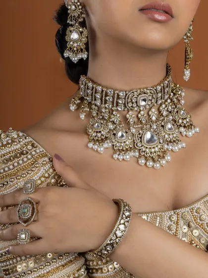 This image displays the full choker set, including the matching earrings, bangles, and rings. It's a complete look that exudes traditional elegance.