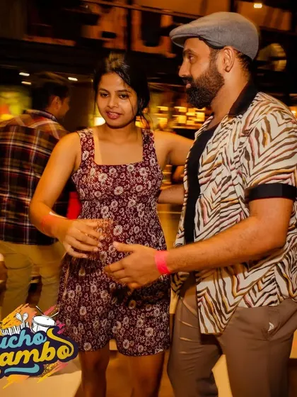 A stylish couple celebrating a birthday on the floor. Our socials are the perfect backdrop for any celebration.