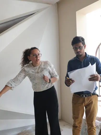 Our principal architect, Diana Espinoza, on-site, discussing design details with the team. This is where we bridge the gap between the blueprint and the built reality.