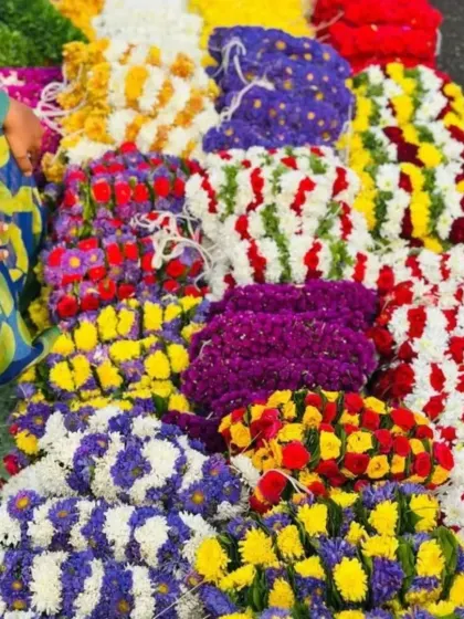 I offer a wide variety of fresh flower arrangements sold at the market. You can see different color combinations and designs, showing the range of options available for your event decoration.