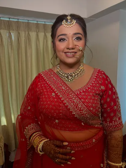 A happy bride ready for her big day. This look features a bright, fresh base with silver-toned eyeshadow to complement her jewelry.