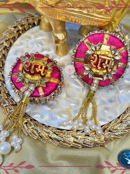 This bright pink "Ram Ram" set is cheerful and festive, perfect for celebrating the joyous bond of Raksha Bandhan.