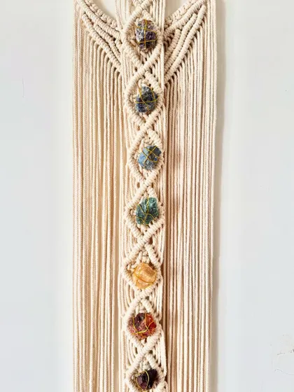 The beautiful, raw chakra stones are the centerpiece of this unique spiritual wall hanging.