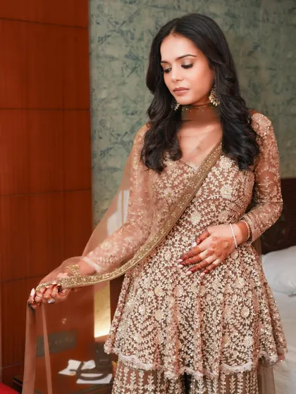 A full-length view of this soft and subtle look. The makeup is designed to be elegant and timeless, perfect for any special occasion.