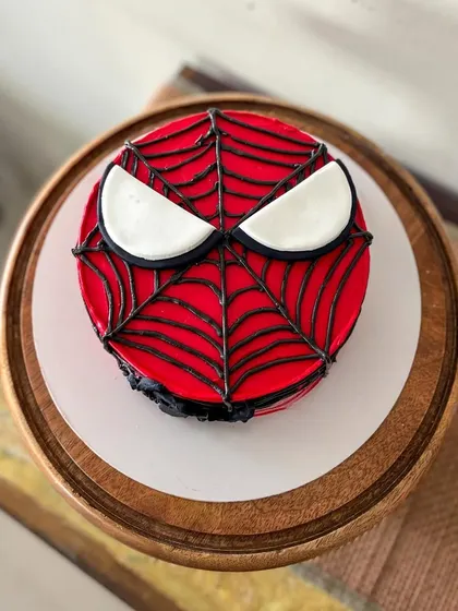 The bright red and black make this superhero cake really stand out.