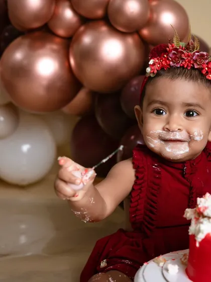 Let's make a mess! A first birthday cake smash is all about capturing pure, uninhibited fun. This little one is having the time of her life, and these are the memories you'll treasure forever.