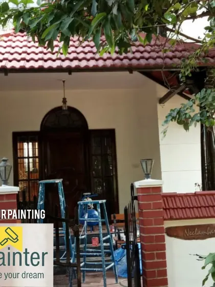An exterior painting project for a traditional-style villa with a tiled roof. The new paint job freshens up the entire facade.